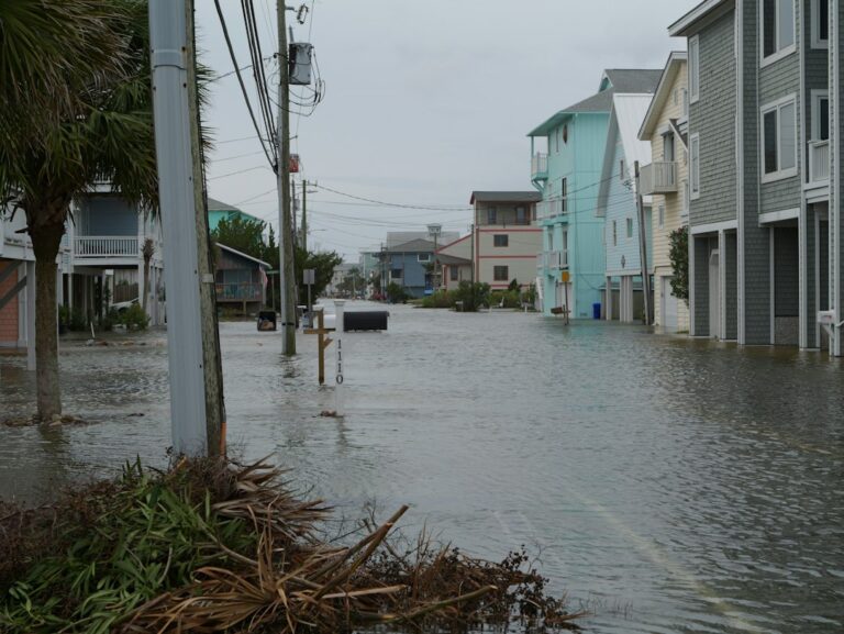 Floodwater covering a residential coastal street