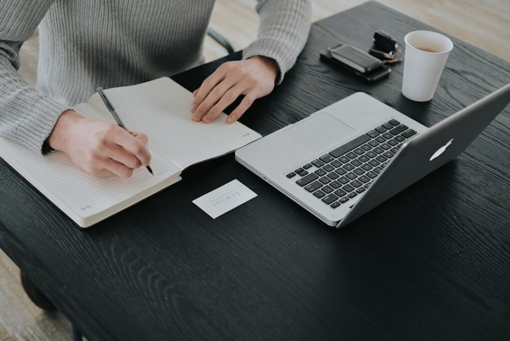 Small business owner working at a desk with a laptop