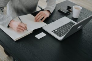Small business owner working at a desk with a laptop